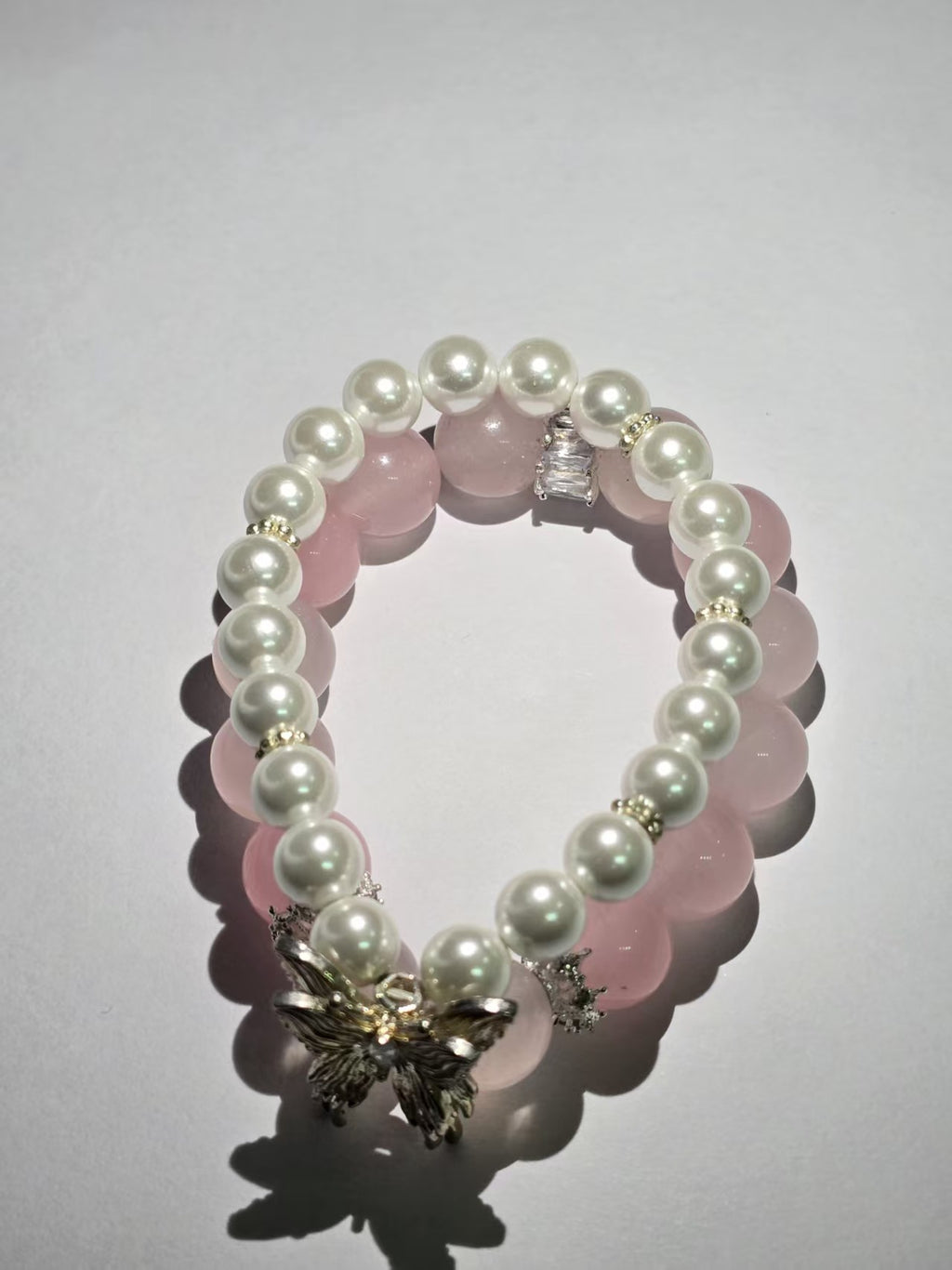 Pink crystal and pearl double-ring bracelet