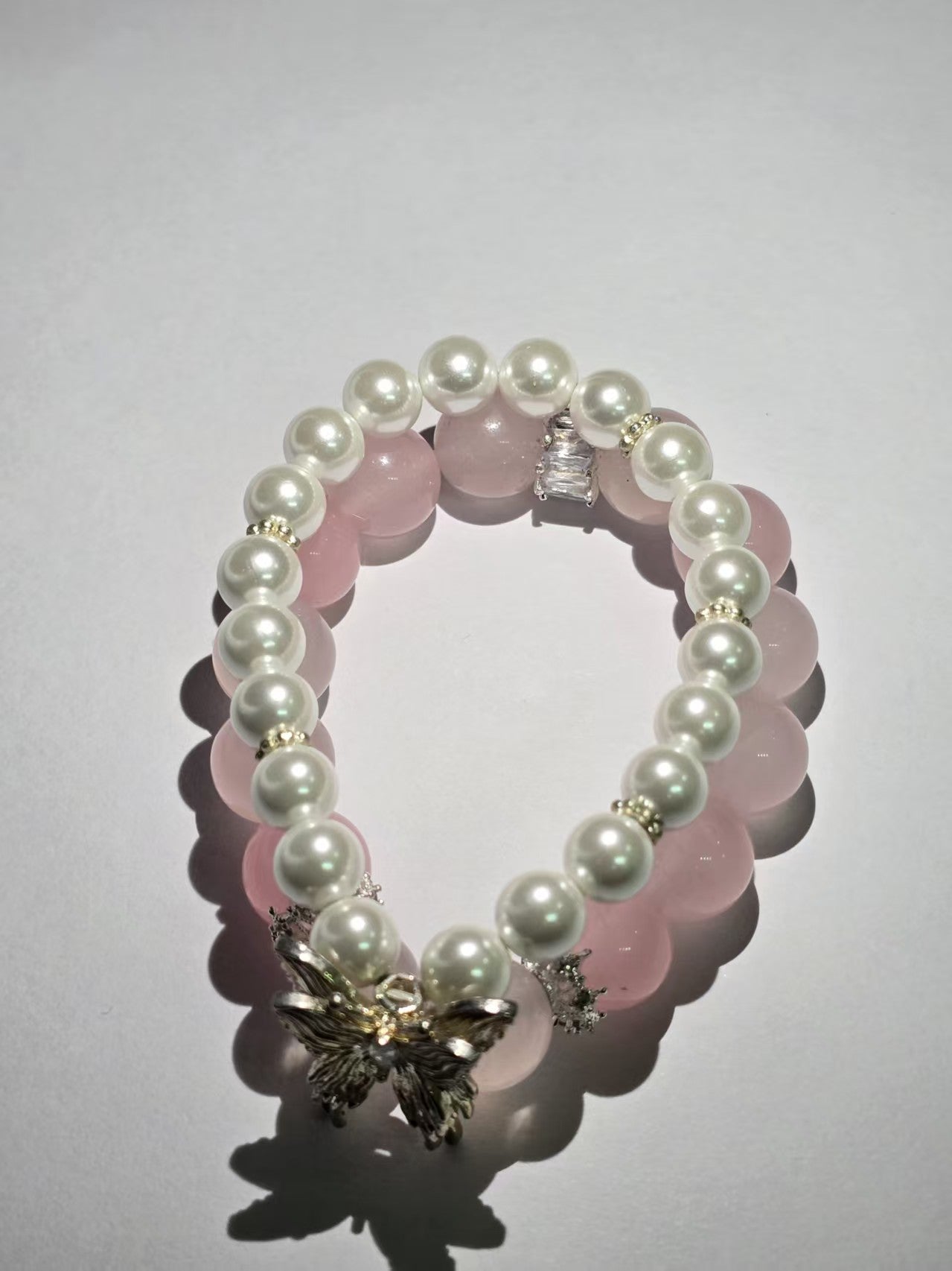 Pink crystal and pearl double-ring bracelet